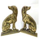 Dog door stops : A pair of cast brass door stops formed as handed Sejant hounds. Each 12 3/4" high