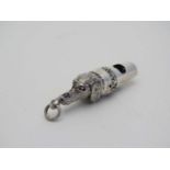 A silver whistle with dog head decoration. Marked ' Sterling ' 1 1/2" long CONDITION: Please Note -