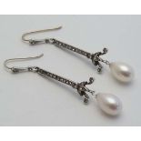 A pair of white metal drop earrings set with paste stones and pearl drops  CONDITION: Please Note -