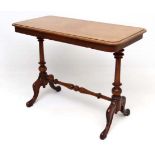 A Victorian mahogany side table with turned pillars and stretcher and a one piece top .17 1/2"