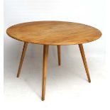 Vintage Retro : A British Ercol Windsor dining table  ( drop flap), no. 384 in blonde Elm and Beech