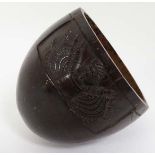 Militaria : An unusual 19thC carved cup , formed from a Tagua nut? One side with a relief