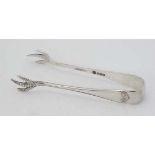 A pair of silver sugar tongs with birds claw grips. Hallmarked Sheffield 1929 maker Cooper