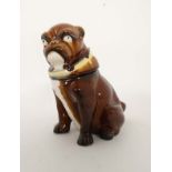 A pottery novelty tobacco pot and cover in the form of a brown glazed seated Bulldog wearing a