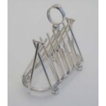 Cricket Interest : A novelty silver plate 7 bar toast rack, the bars formed as crossed cricket