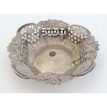 A silver bon bon dish with embossed and pierced decoration. Hallmarked Chester 1902 maker W G Keight