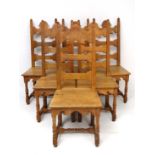 A set of 6 oak French solid seat dining chairs with shaped back and turned stretchers and shaped
