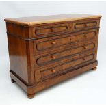 A French walnut chest of drawers with oak lining comprising of 2 short over three graduated long