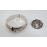 A 925 silver bangle formed bracelet together with a white metal brooch with Art Nouveau style