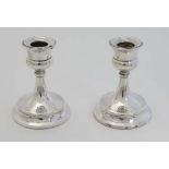 A pair of silver short candle sticks hallmarked Birmingham 1922 maker Sydney Co. 3 1/2" high