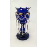 A 19thC blue glass table lustre with gilt and white enamel decoration and 12 clear glass lustre