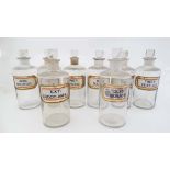 Apothecary Bottles : a set of 8 Chemists / Pharmacy bottles , each with stoppers and recessed