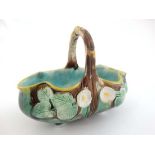 A 19thC Majolica pottery basket by Joseph Holdcroft modelled as a branch with foliate style
