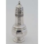 A silver plate sugar caster of octagonal baluster form by Walker & Hall . Approx 6 1/2" high