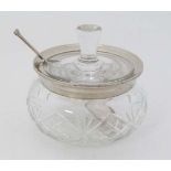 A cut glass preserve pot with silver rim hallmarked London 1928 maker Henry Perkins & Sons. With