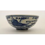 A  Chinese blue and white porcelain bowl. Decorated with oriental birds in flight. Four Chinese