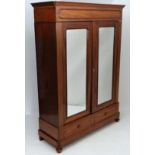 A c.1900 mahogany 2 door mirrored armoire opening over 2 drawers under and sting on turned bun