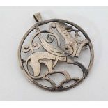 A Scottish silver brooch / pendant with  image from Harness Ornament Ouendale Shetland .