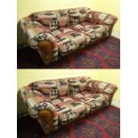 A pair of Contemporary large 2 seat kilim covered Chesterfield sofas and an associated footstool .