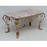 A 1920's  coffee table with white marble top with rouge veining and having acanthus and gold