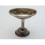 A 19thC silver plate pedestal eye bath / miniature funnel, the eye bath of oval form with pull-off