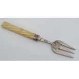 A 19 thC ivory handled bread fork with rope twist handle and silver plated fork, 8 1/2" long