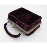 A  circa 1900 French velvet purse form necessaire set containing a silk lined interior with white