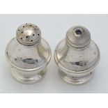 A 2-piece silver cruet set comprising salt and pepperette. Hallmarked Birmingham 1986 maker C Ltd.