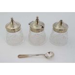 A 3 piece cut glass cruet with silver plated mounts comprising salt pepper and mustard  with