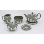 A collection of 6 items of Wedgewood Sage Green Jasperware. To include teapot and stand, jug, lidded