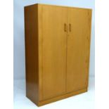 Vintage Retro :a British  G-Plan  Brandon Blonde light oak double wardrobe  designed by Victor