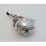 A 925 silver pendant formed fob seal with central rotating section with hinged locket