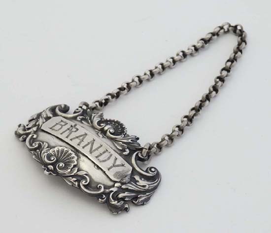 A Victorian silver brandy label with acanthus scroll and shell decoration hallmarked London 1839 - Image 3 of 4