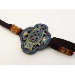 Tibetan Jewellery - A pierced and enamelled quatrefoil with a woven choker with Buddhist good luck