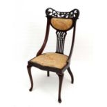 A c.1900 carved mahogany single chair with shield shaped seat and cabriole legs 38" high  CONDITION: