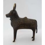 Antiquity : A hollow cast bronze image of a standing horned cow /  bovine with ornate head