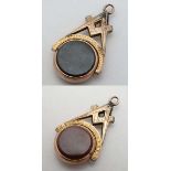 Masonic Pendant Fob: a gilt metal Compass and square with rose gilt circular revolving Cornelian and