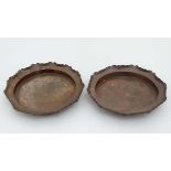 Arts and Crafts : A pair of circular wavy edged dishes with hammered decoration to centre marked '