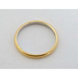 A gold and platinum wedding band  CONDITION: Please Note -  we do not make reference to the