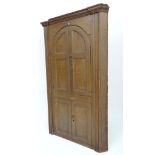 A Victorian pine comb decorated floor standing corner cabinet with 2 pairs of opening doors ( the