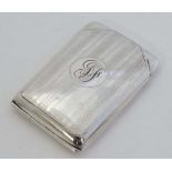 A silver match book cover of folding form with engraved engine turned decoration. Hallmarked