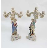 A pair of ceramic figural candelabrum.  Marked under. Possibly Samson reproduction. 18 1/4'' high