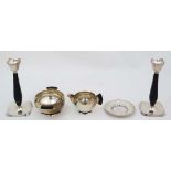 An Art Deco Danish silver plate sugar bowl and cream jug with ebonised handles marked under ALP.