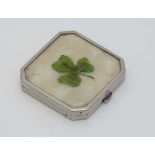 A silver plate powder compact with mother of pearl and shamrock decoration 1 3/4" wide  CONDITION: