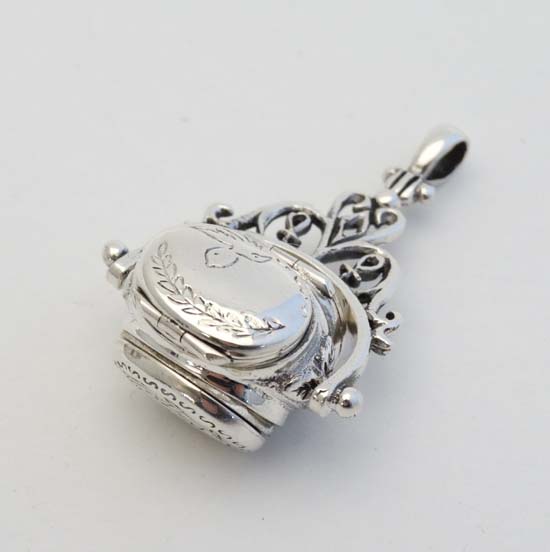 A 925 silver pendant formed fob seal with central rotating section with hinged locket - Image 9 of 10