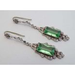 A pair of white metal drop earrings set with green and white stones  CONDITION: Please Note -  we do