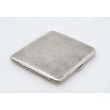 An Art Deco silver cigarette case with engine turned decoration London 1940 maker TWL 3 3/4" x 3 3/