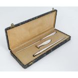 A cased  Continental silver desk set comprising a .835 silver handled letter opener, hand seal and