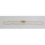 A string of freshwater pearls with 9ct gold clasp 16" long  CONDITION: Please Note -  we do not make