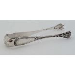 A pair of white metal sugar / ice tongs , the grips formed as hairy lions paws. Indistinctly marked.